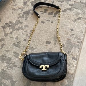 Tory Burch black shoulder bag or crossbody bag.